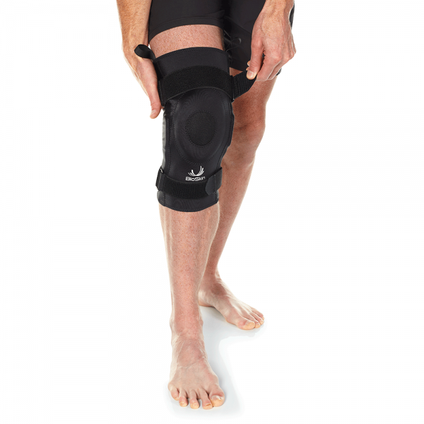 Hinged knee brace for stability